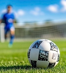 https://www.ahqafmedia.com/public/uploads/images/newsimages/maannewsimage18022026_164317_pngtree-closeup-of-a-soccer-ball-on-field-and-a-soccer-player-image_16536616.jpg